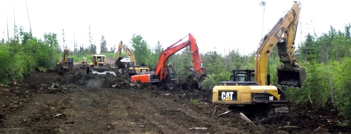 Road Construction Through Muskeg Using Dozers and Excavators